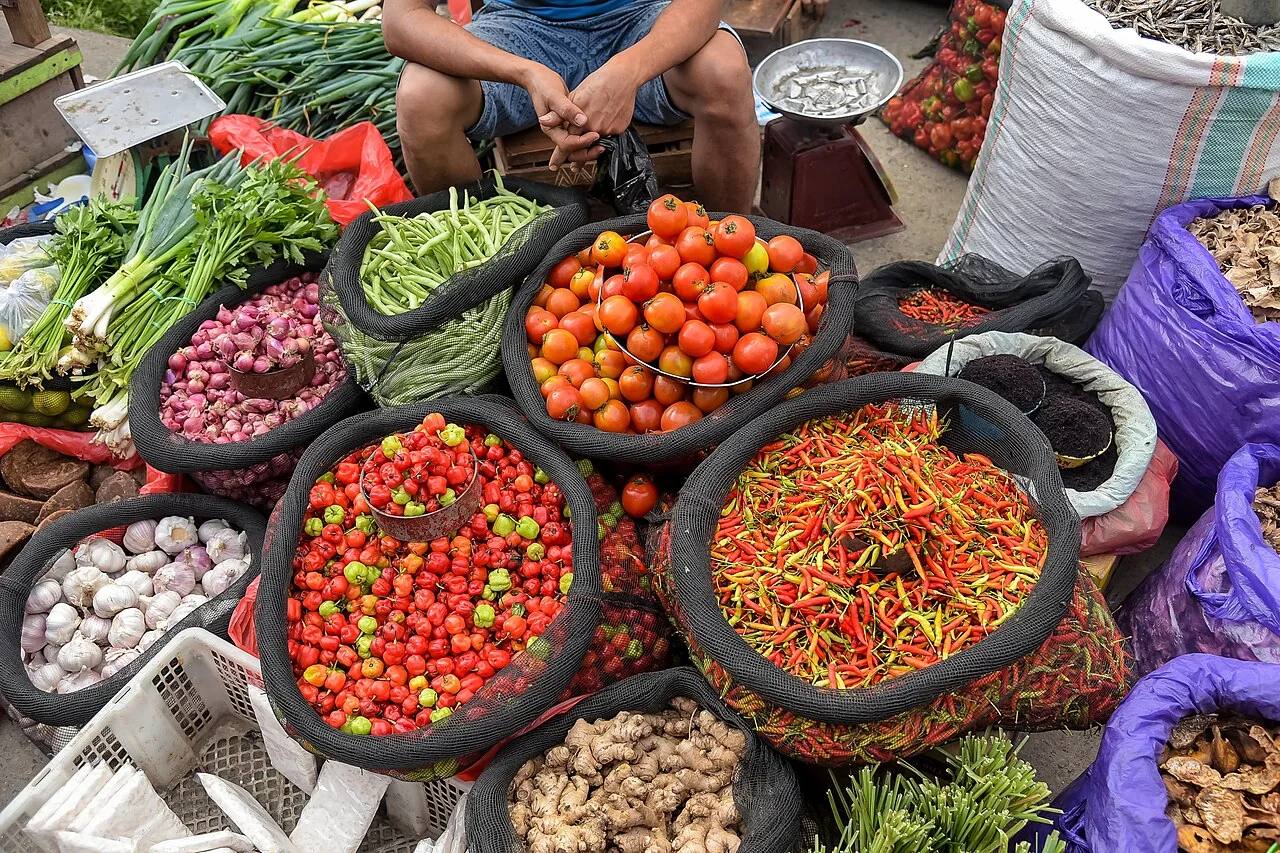 Baskets of chillies, tomatoes and shallots at Bolu Market in Rantepao