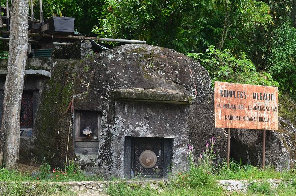 Rock-cut tombs and a sign identifying the Bori Kalimbuang megalithic complex