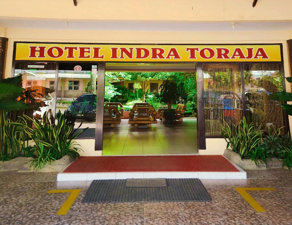 Hotel Indra Toraja entrance with a sign above the doorway